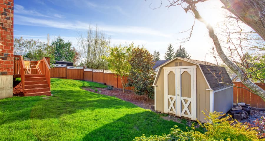 Fenced backyard with storage shed in Montgomery